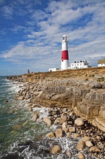 Red and white lighthouse on the coast at Portland Bill, Isle of Portland, Dorset, England, United
