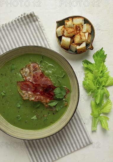 Green mashed soup, with bacon and croutons, homemade, no people