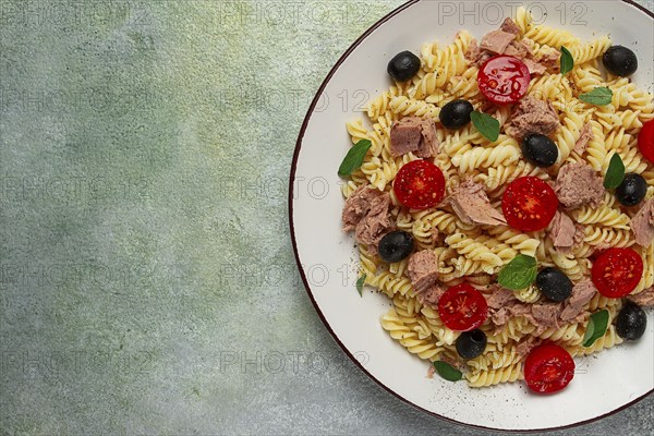 Tuna salad, fusilli pasta, olives and cherry, olive oil, homemade