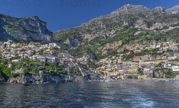 View from the boat of the village on the cliffs above the sea, Positano, Amalfi Coast, Amalfitana,
