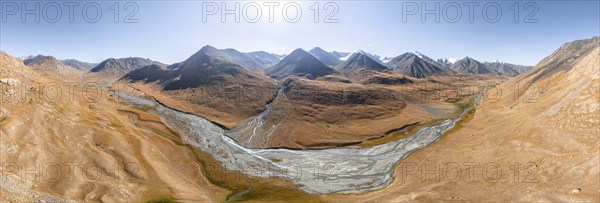 Aerial view, Burkhan mountain valley with meandering river, barren dramatic mountain landscape,