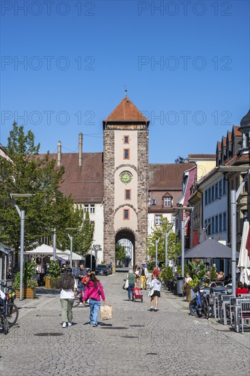 Pedestrian zone, shopping street with the Obertor, historic town gate of Villingen,