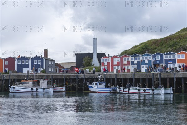 Colourful lobster shacks on the harbour promenade, Börteboote, offshore island of Heligoland, North