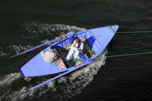 Souvenir dealer with a rowing boat on the Nile, Egypt, Africa