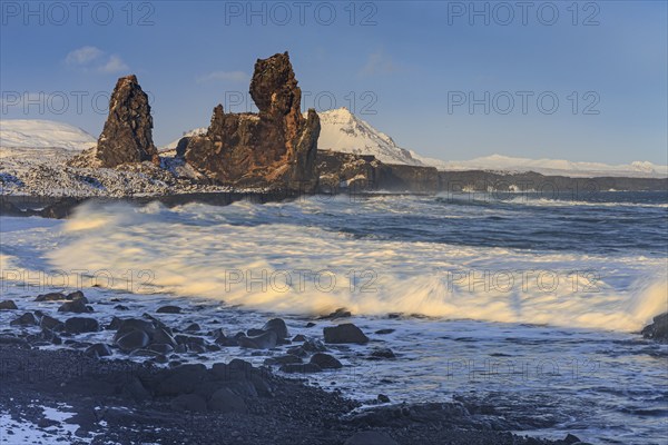 Rocks and surf on the coast, evening light, sun, snow, winter, Arnarstapi, Snaefellsnes,