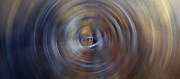 Horizontal abstract background featuring dark soft circles with circular glow lights rings in blue