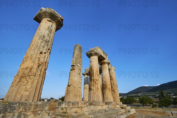 Archaic Temple of Apollo, Doric Columns, Historic columns against a picturesque backdrop of nature