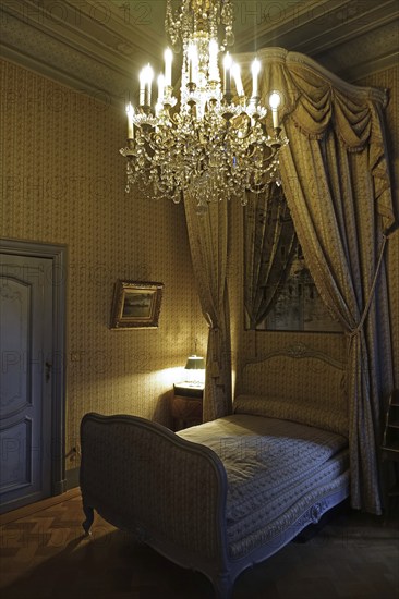 Chandelier and canopy bed in the Marquise's apartment at Kasteel van Gaasbeek, renovated medieval