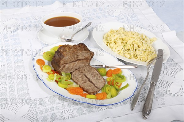 Swabian cuisine, roast beef, roast ox, herb spaetzle, meat dish, gravy, carrot vegetables, leek,
