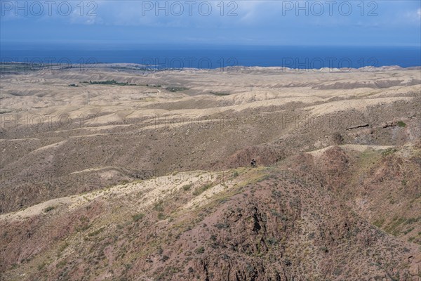 View of arid landscape and Issyk Kul Lake, Kyrgyzstan, Asia