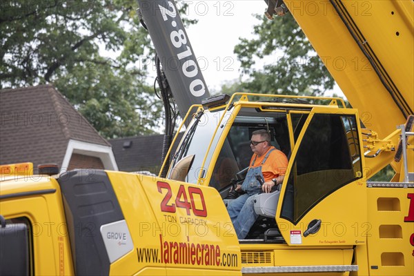 Detroit, Michigan, A storm with 70mph wind gusts blew down a 15-ton, 110-foot cottonwood, damaging