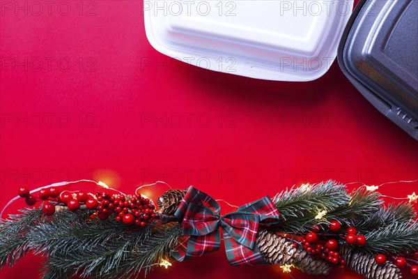 Christmas decor of food delivery service containers. New year's eve promotion. Ready-made hot