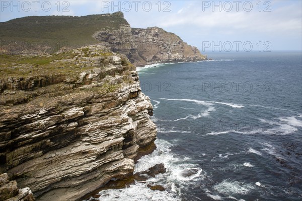Rocky coast at the Cape of Good Hope with cliffs of rock layers