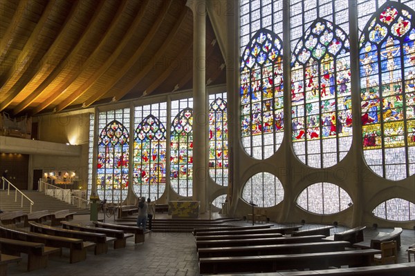 Rouen, France, August 30, 2018: Old Renaissance stained glass windows in a modern catholic church