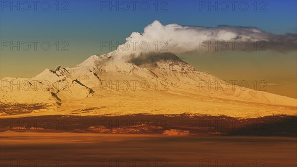 Eruption crater active volcano on Kamchatka Peninsula, winter volcano landscape at sunrise.
