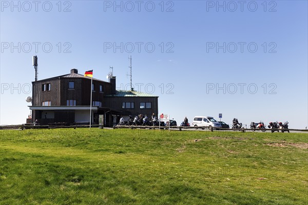 Restaurant and café, motorbikes in car park, Köterberghaus, mountain peak, sunny spring weather,