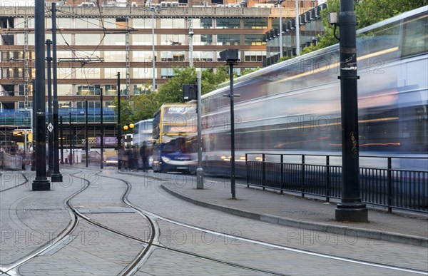 Manchester, England, September 23, 2016: Piccadilly central bus and metro station with moving tram