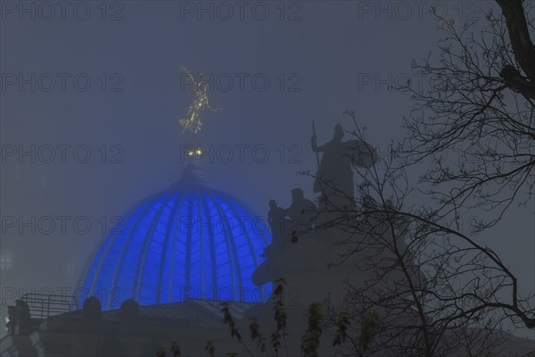 The old town of Dresden shrouded in November fog. Octagon dome with Fama and pediment figures of