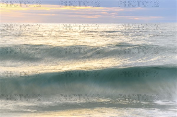 Wave crashing on a sandy beach of the Atlantic Ocean. Sables d'Olonne, Vendee, Pays-de-la-Loire,