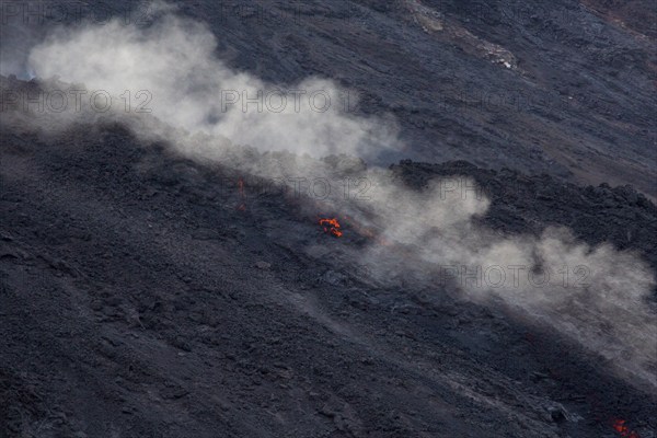 Glowing lava on lava rock from Stromboli crater