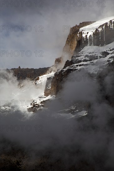 Summit of Kilimanjaro covered with snow and sunlight