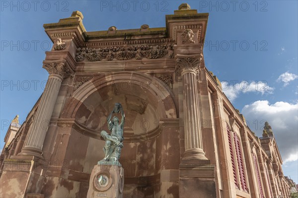 The statue of the winegrower, work of Auguste Bartholdi in front of the covered market in the city