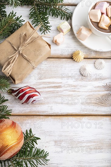 Christmas or New Year frame composition. Decorations, box, balls, cinnamon, ribbons, fir and spruce
