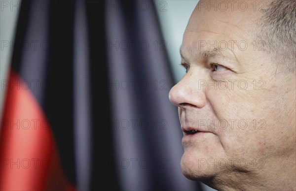 Olaf Scholz, Federal Chancellor, speaks at a press conference during the visit of Denis Becirovic,
