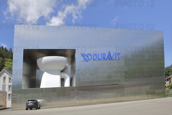 Modern building of Duravit-AG with oversized toilet bowl, oversize, XXL, size comparison, car,