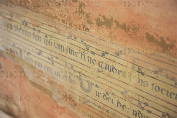 Fragment of music, fresco, of a Franciscan hymn, Assisi, Umbria, Italy, Europe