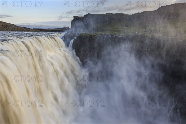 Large waterfall in a gorge, spray, rapids, summer, midnight sun, Dettifoss, North Iceland, Iceland,