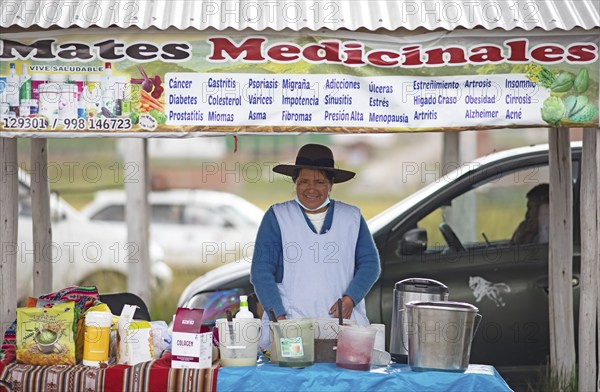 Peruvian woman sells medicine against cancer and diabetes at the indigenous market in Chinchero,