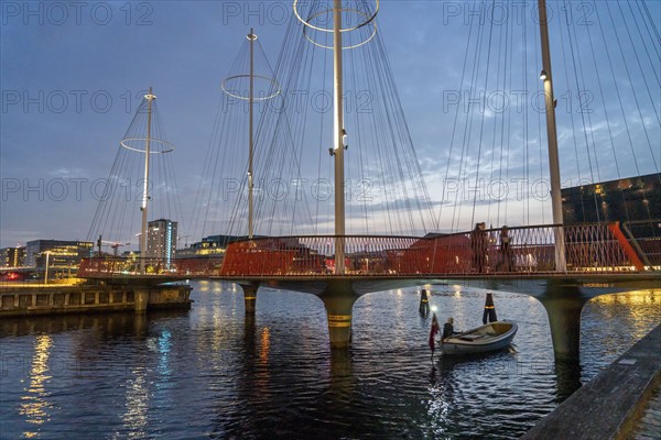 Cyclists on the Cirkelbroen cycle and pedestrian bridge, over the harbour, in the Christianshavens