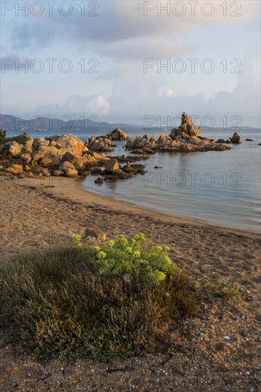 Lonely beach with granite rocks, sunrise, Spiaggia Poltu Manzu, Capo Ceraso, near Olbia, Sardinia,