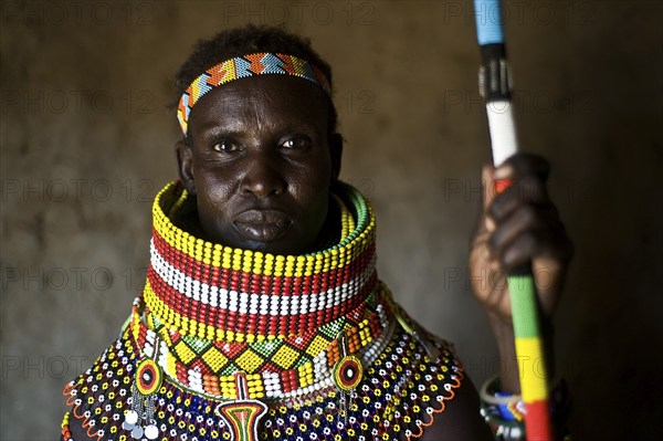 Portrait of a woman from the Turkana tribe, Kenya. She is adorned with traditional beadwork