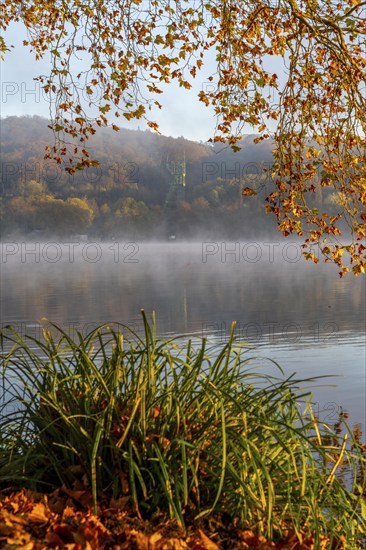 Headframe of the former Carl Funke colliery in Heisingen, autumn atmosphere at Lake Baldeney,