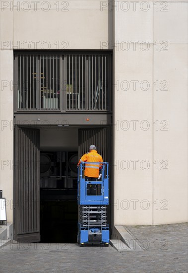 Construction worker with construction machine, Berlin, Germany, Europe