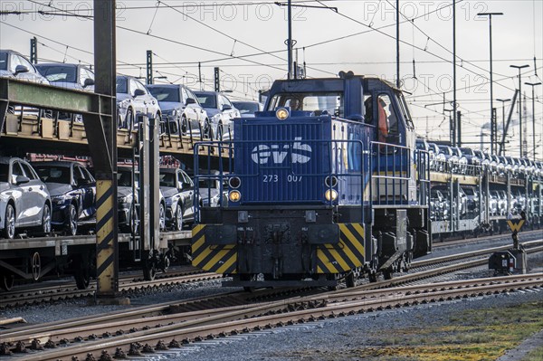 Car train, goods train on its way to the car terminal in Bremerhaven seaport, new German cars for