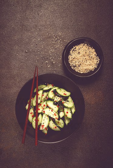 Chinese salad, cucumbers with chili pepper and sesame seeds, homemade, no people