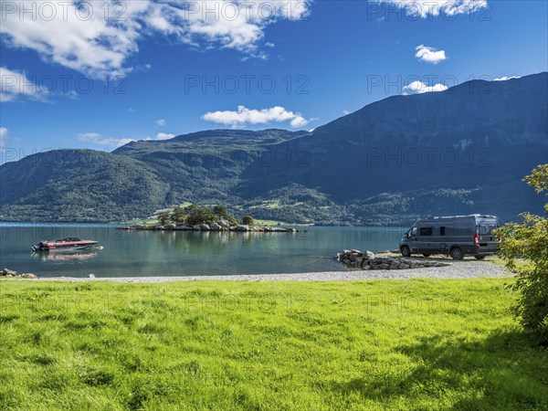 Campervan at the Sognefjord, island in the back, summer, Norway, Europe