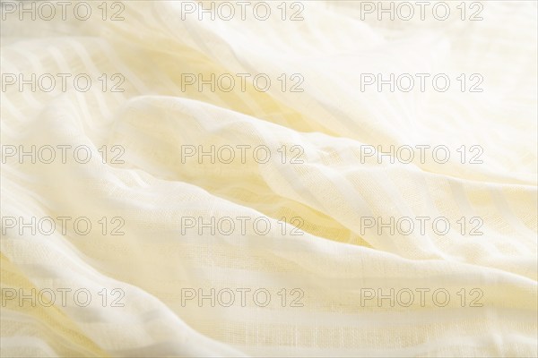 Fragment of white linen tissue. Side view, natural textile background and texture. wave concept,