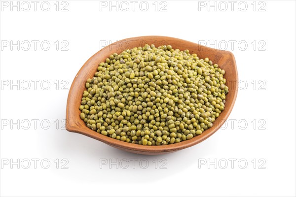 Clay bowl with raw green mung bean isolated on white background. Side view, close up