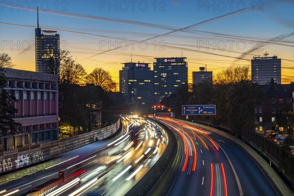 Evening traffic, partly with traffic jams, slow-moving traffic on the A40 motorway, skyline of