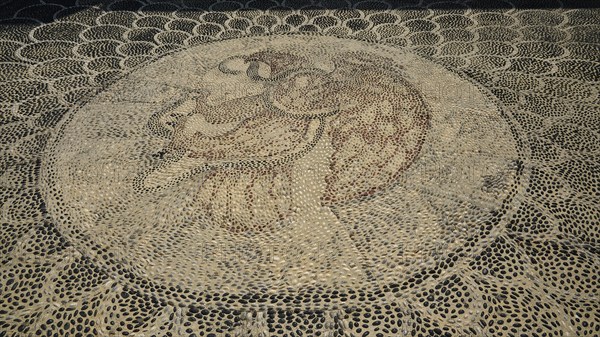 Pebble mosaic with an intricate facial motif, Mandraki, Nisyros, Dodecanese, Greek Islands, Greece,