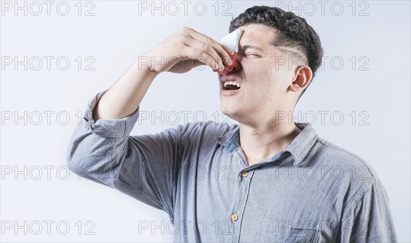 Man suffering from sinusitis isolated. People suffering with irritated nose isolated. Concept of