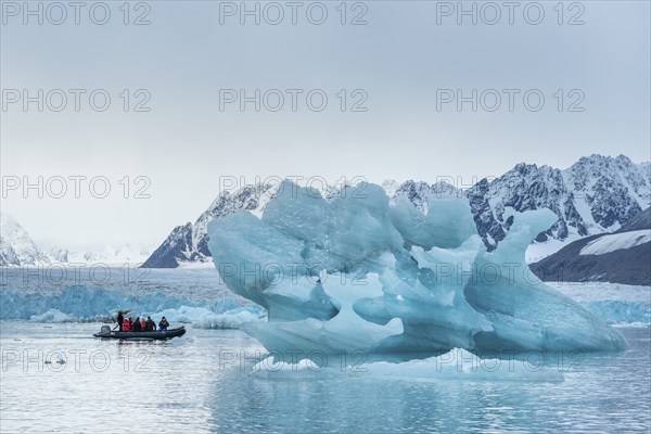 Dinghy with tourists, iceberg and glacier edge of Monacobreen, Liefdefjord, Woodfjord area,