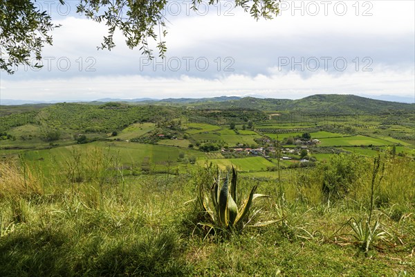 View south east from Apollonia over fields, countryside, hills, village of Kryegjatë, Fier County,