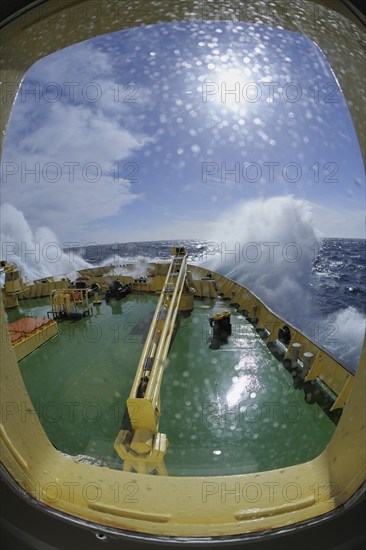 Bullseye with sunb look to bow of Icebreaker Kapitan Khlebnikov in rough seas at the way to