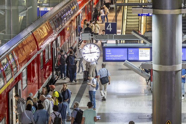 Platform with passengers, Gesundbrunnen station with Deutsche Bahn AG regional train. Berlin,