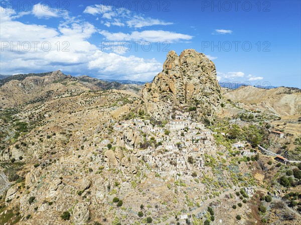 Mountains and Olive groves around Ghost Town from a drone, Pentedattilo Village, Calabria, Italy,